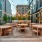 seating in the terrace area with string lights and surrounding city views