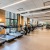 open fitness area with equipment and on wooden floors