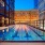 overhead view of roof-deck pool showing swimming lanes and city views