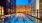 overhead view of roof-deck pool showing swimming lanes and city views